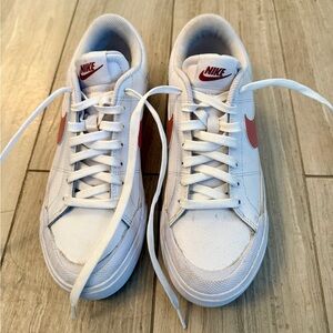 Nike White Low-Top Sneakers with rose pink Swoosh